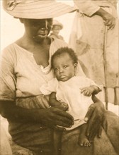 Woman with infant, Old Bight, Cat Island, Bahamas, 1935