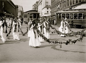 Women with Festoons march in DC Parade 1914