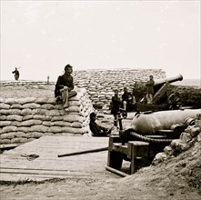 Yorktown, Virginia (vicinity). Federal soldiers in Confederate battery (protected with sand bags) south of Yorktown. 32-pdr. Navy gun in foreground, far gun - 24-pdr. siege piece