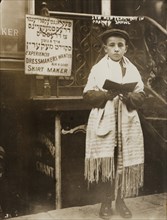 Jewish Boy in Prayer shawl and Sidur celebrates the Hebrew New Year