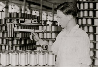 Young Boy Weighs Spools of Silk Thread 1924