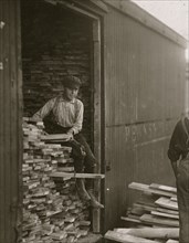 Young boy working for Hickok Lumber Co. Location: Burlington, Vermont. 1910