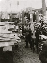 Young boy working for Hickok Lumber Co.,  1910