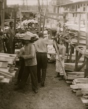 Young boy working for Hickok Lumber Co.,  1910