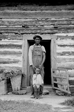 Young sharecropper and his first child 1939