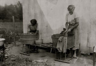 Zelina & Florence Richards, 12 and 13 years old doing the family wash 1916
