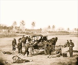 Zouave ambulance crew demonstrating removal of wounded soldiers from the field 1863