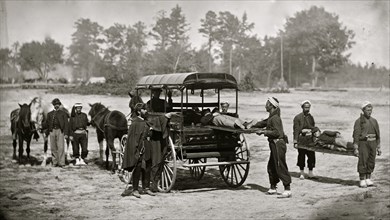 Zouave ambulance crew demonstrating removal of wounded soldiers from the field 1865