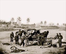 Zouave ambulance crew demonstrating removal of wounded soldiers from the field 1864