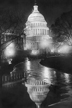 U.S. Capitol Builing in a light night rain 1920