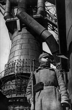 Red army soldier guarding a factory in the 1920s.