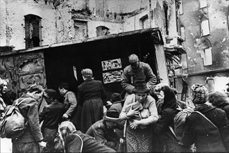 Red army soldiers distributing bread to berlin residents after germany's surrender, world war 2, 1945.