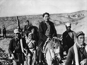 Chairman mao zedong (tse tung) on horseback during the chinese civil war against the kuomintang (nationalist) forces, shenzi province, northern china, 1947.