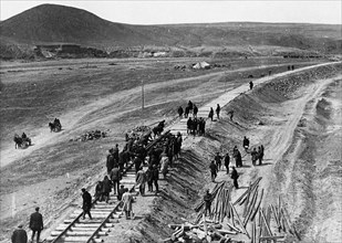Workers laying track for the turkistano-siberian railroad line (1927-1930).