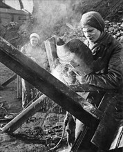 Women welding 'hedgehogs' (anti-tank barricades) as part of the civilian war effort for the defense of moscow during world war 2.