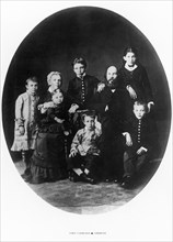 The ulyanov family in simbirsk in 1879, the seated are lenin's parents, maria alexandrovna and ilya nikolayevich, who was a public school inspector, the children are (standing from left to right): olg...
