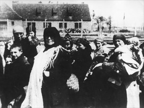 Polish peasant women and children from the zamosc district arriving at auschwitz concentration (death) camp, poland, world war 2, holocaust.