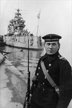 Black sea fleet, a soviet sailor on watch at the battleship paris commune, march 1943.