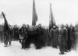 Lenin's funeral, members of the politburo (joseph stalin, left front) carrying the casket into the crypt near the kremlin wall in red square, moscow, january 1924.