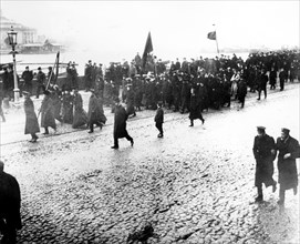Students of university quay demostrate with red flags in petersburg in 1905.