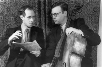 Russian cellist and post-graduate of the tchaikovsky state conservatory of moscow, matislav rastropovich (left), giving instruction to v, alabin, a conservatory student, october 1951.