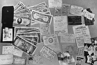 Currency, documents, and personal photographs found on u2 spy plane pilot francis gary powers after he was shot down over soviet territory on may 1, 1960, ussr.