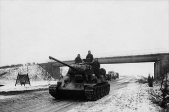 A soviet t-34 tank on the berlin highway in 1945.