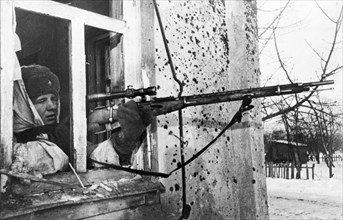 World war 2, a red army sniper firing on fleeing german soldiers.