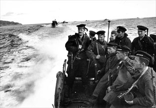 An amphibious marine force is disembarked from the ships of the soviet north fleet in 1942.