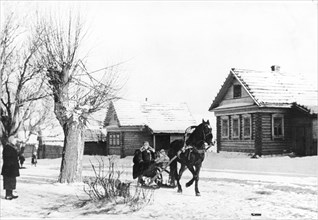 A horse-drawn sled in a russian village, 1930s.