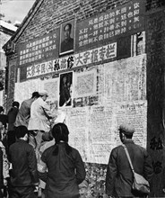 Big character wall posters put up by peasants of tachai and soldiers of the people's liberation army which 'follow chairman mao's great strategic plan and unfold mass revolutionary criticism and repud...