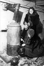world war ll: leningrad blockade, women getting hot water in 1942.