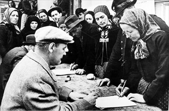 Collective farmers signing the appeal for the conclusion of a five-powers peace pact in romania, 1952.