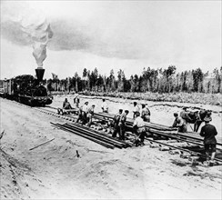 Workers laying track for the central portion of the trans-siberian railroad in the krasnoyarsk region of russia, 1899, this section of the railway runs between the ob and yenisey rivers.