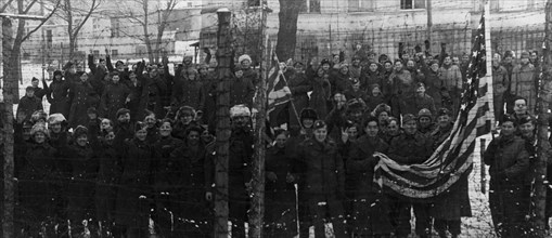 The red army freed them, americans and british prisoners of war in the yard of a german prison camp, near poznan,  they wanted to have their pictures taken behind the barbed wire fence, which separate...