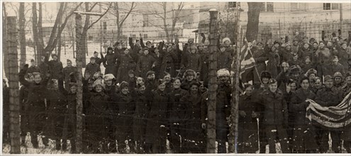 The red army freed them, americans and british prisoners of war in the yard of a german prison camp, near poznan,  they wanted to have their pictures taken behind the barbed wire fence, which separate...