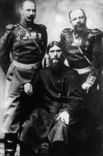 Grigori yefimovich rasputin (seated) with two russian officers, 1890s.