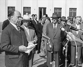 The party-government delegation from the gdr arrive in moscow, 1959, walter ulbricht making a speech at vnukovo airfield as khrushchev looks on.
