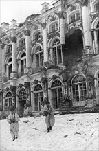 Soldiers in front of catherine palace in tsarskoye selo which has been severely damaged by the germans, january 1944.