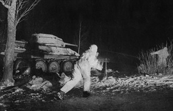 Red army troops and a t-34 tank during a night engagement, world war 2, february 1944.