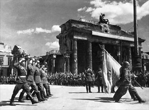 Soviet red army troops during a victory parade in front of the brandenburg gate in berlin, germany at the end of world war 2, may 20, 1945.
