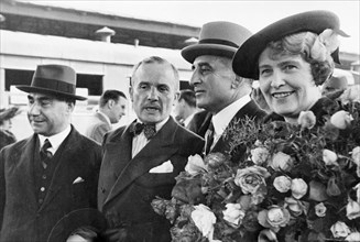 Former american ambassador, joseph e, davies with his wife at the byeloruskiy railway terminal in moscow as they were leaving for america, june 1938, on the left is the iranian ambassador and next to ...