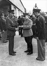 Marshal georgy zhukov meets general eisenhower and field-marshal montgomery and hands out orders and medals to officers of the american army, 1945,world war 2.