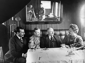 Leon trotsky (far right) entertains unidentified officials in his railway carriage office, soviet union.