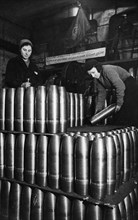 Civilian women involved in the production of artillery shells at a munitions factory in moscow during world war 2, march 1942.
