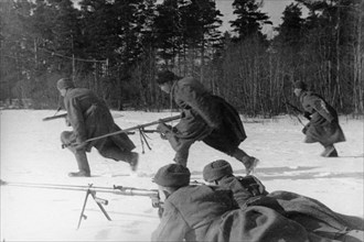 Anti-tank rifle men of the 'x' lithuanian unit taking up new firing positions on the first baltic front, world war 2, april 1944.