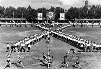 Song festival in riga, sport performance of the pupils of the training institutions of the administration of labor reserves of the latvian ssr on the occasion of the 10th anniversary of soviet latvia,...