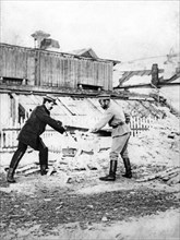 Tsar nicholas ll cutting wood with pierre gilliard, the tutor of tsarevich (prince) alexei, during their imprisonment in tobolsk in 1918.