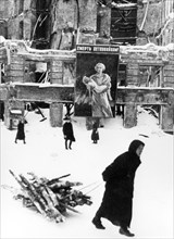 Leningrad blockade during world war ll, poster reads: 'death to the child murderers!'.