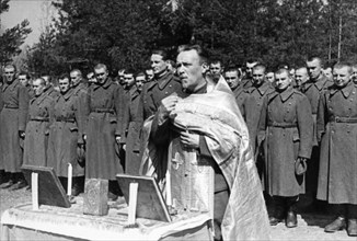 World war 2, yugoslavian military unit training in the soviet union, may 1944, troops during morning prayers, ministered by an orthodox priest.